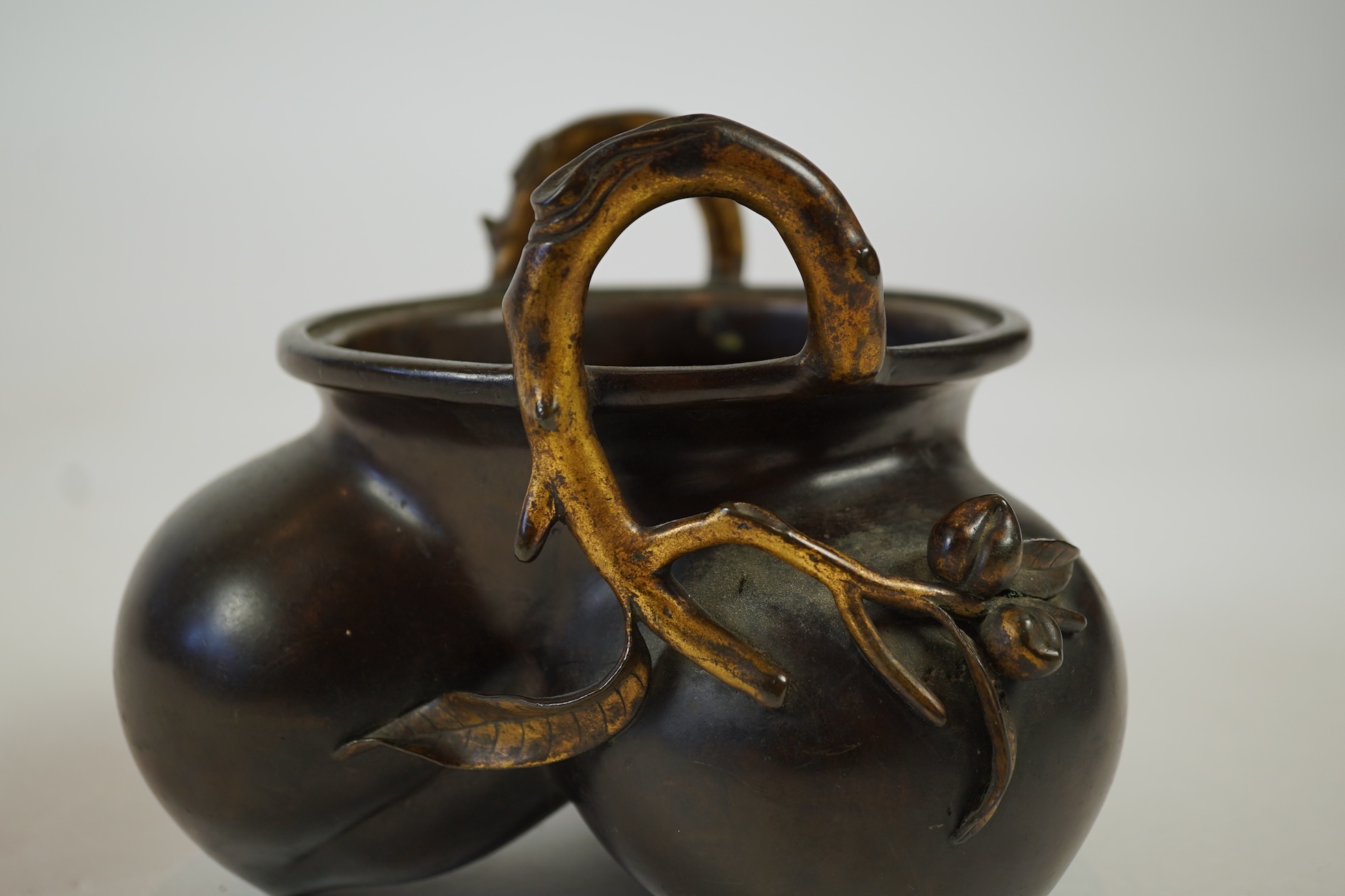 A large Chinese bronze and parcel gilt ‘peach’ censer and cover, Li, 17th/18th century